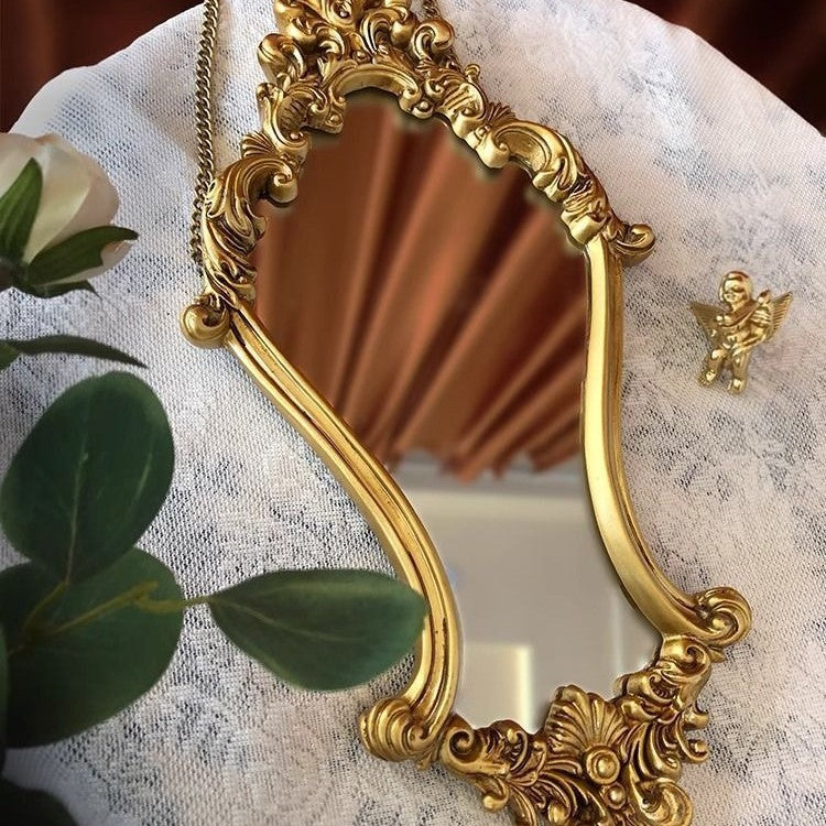 Golden carved beauty mirror